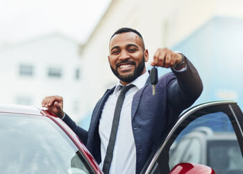 Shot of a well-dressed man holding the keys to his new car