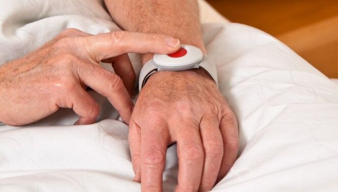 rufhilfe with a senior emergency phone in bed