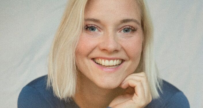 Man får en storsmilende Anna Vind, når samtalen lander på musik. Foto: Terese Vadum.